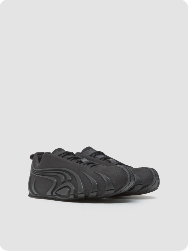 Puma Mostro Triple Black sculptural pair view